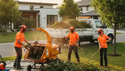 Professional shrub removal crew clearing overgrown bushes in a Memphis, TN residential yard